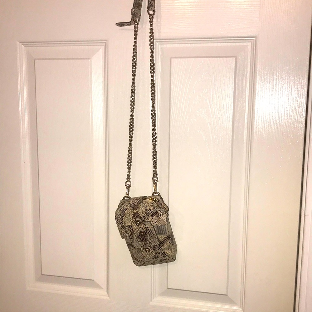 This is a nude and brown fabulous and brand new snake skin bag